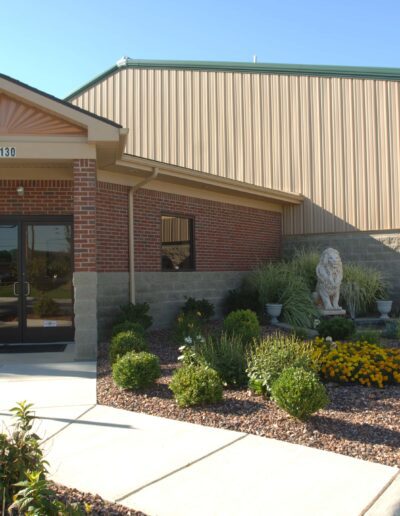 Modern commercial building with a landscaped front entrance.